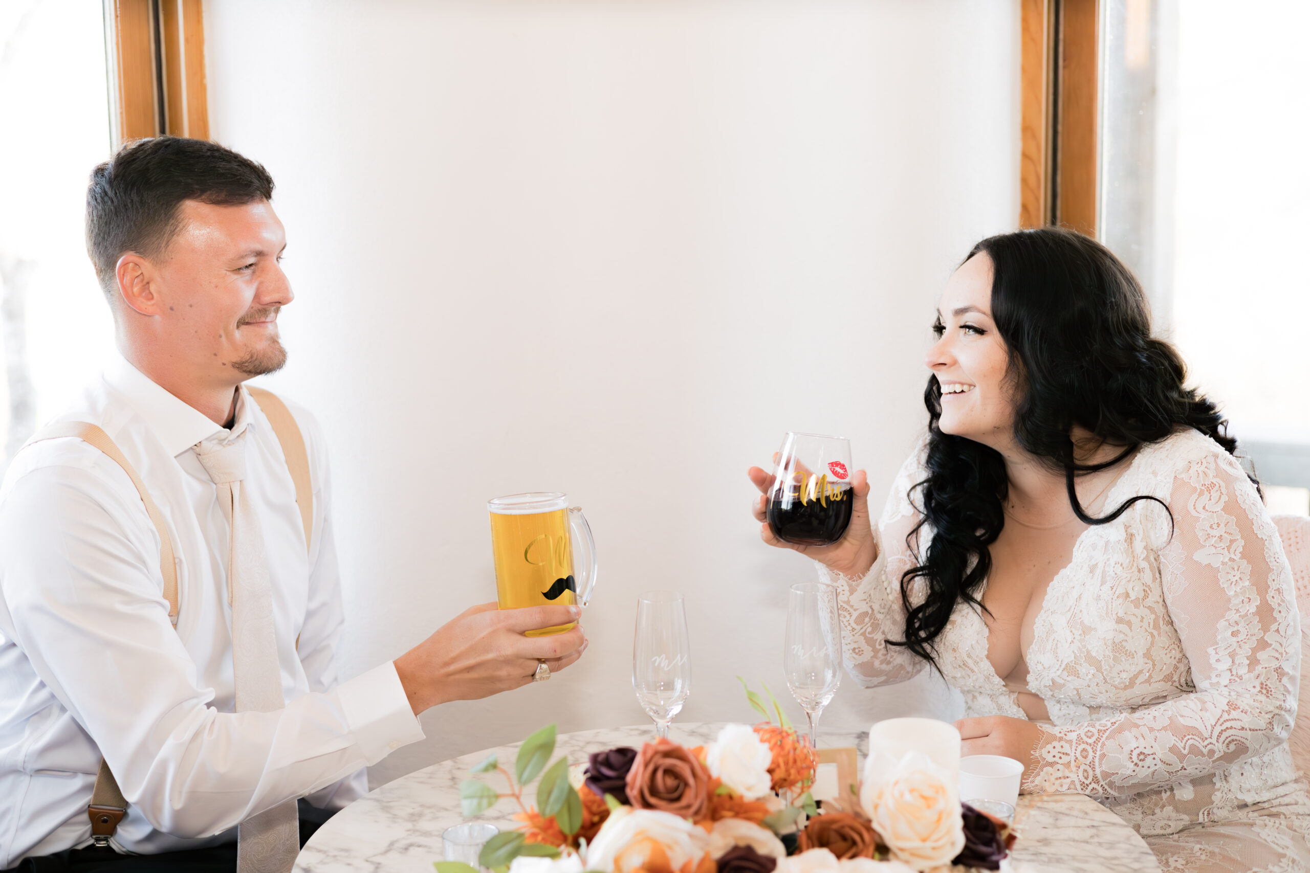 cute bride and groom toast during an elopement